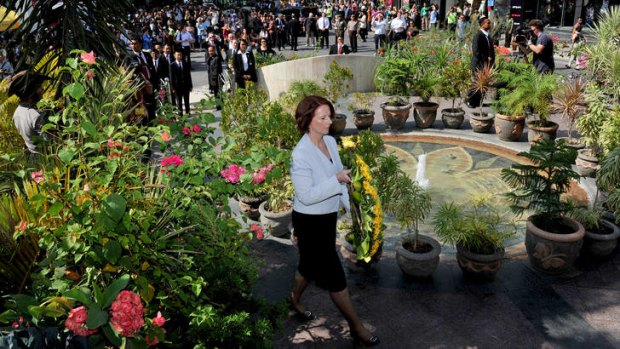 Moved: Julia Gillard pays her respects at the Bali bombings memorial monument.