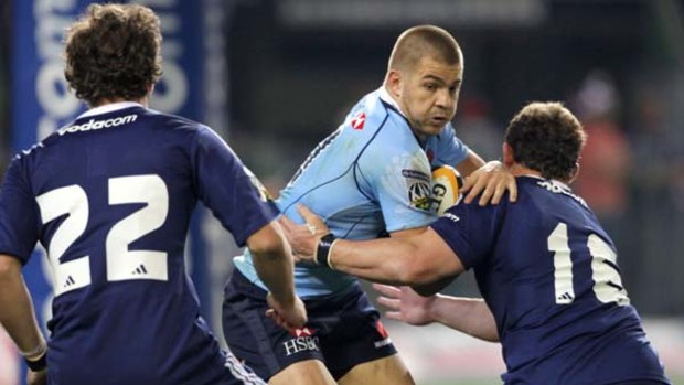 No room to move . . . Drew Mitchell of the Waratahs was kept quiet by the Stormers defence.