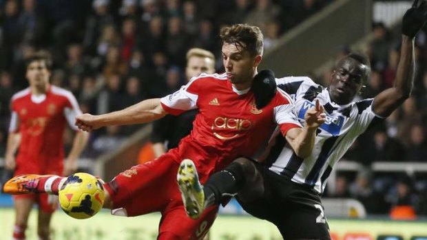 Hard-fought: Southampton's Jay Rodriguez is challenged by Newcastle's Cheick Tiote as he shoots.