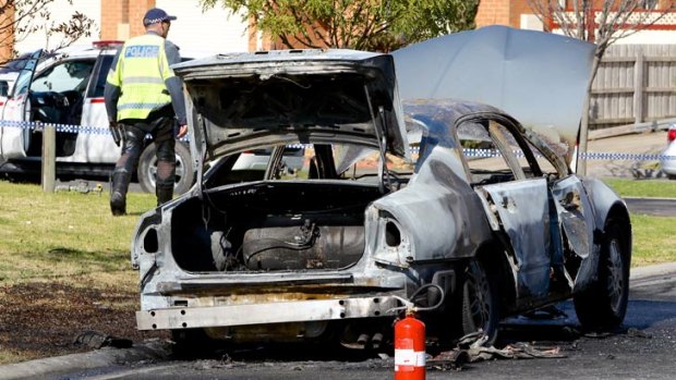 The burnt out shell of a woman's LPG-fuelled Mitsubishi Magna that caught fire in Cranbourne this morning.