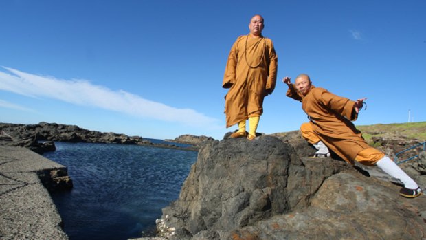 A living tradition of kung fu ... the abbot of the Shaolin Temple in China, Shi Yong Xin, with Shi Yankuo striking a pose.