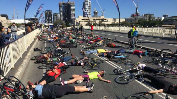 Cyclists protest over plans for a shared lane with pedestrians on Victoria Bridge.