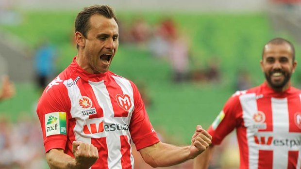 All Heart: Melbourne talisman Richard Garcia celebrates after scoring the first goal in the draw with Newcastle at AAMI Park on Saturday.