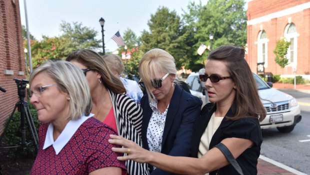 Molly Shattuck, second from right, arrives at the Sussex County Courthouse in Georgetown, Delaware, for sentencing.