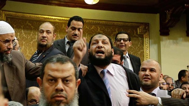Final cut &#8230; Egyptian politician Anwar Bilkimy (centre) in the Parliament before being forced to resign his seat.