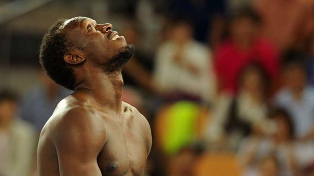 Jamaica's Usain Bolt reacts after being disqualified for a false start in the men's 100 metres final.