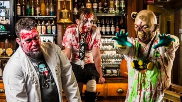 Plastered: Did Zombies Colin O'Mullane, left,  Victoria Ashman and Neil Stork-Brett get into the rotgut in King O'Malley's before the 2013 zombie walk?