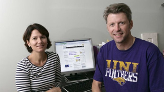 Easy...Michael Finn, with wife Christine, appreciates the instant access offered by E*Trade.