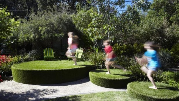 Children frolic in the Wallbrinks' garden in Beaumaris.