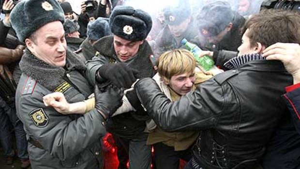 ‘‘Down with Putin’’: Police seize an anti-government demonstrator as thousands gathered to protest in the heart of Moscow.