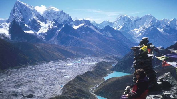 A tourist takes in the view of the Himalayas from Gokyo Peak.