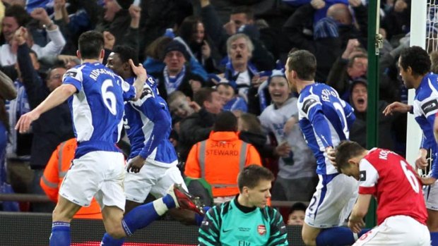 Birmingham City's Obafemi Martins (second from left) celebrates after scoring the winning goal against Arsenal during their 2-1 English League Cup soccer match final victory at Wembley Stadium.