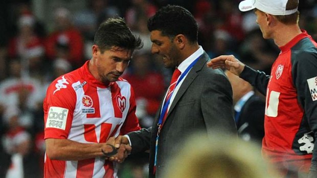 Harry Kewell and coach John Aloisi after the team lost to Melbourne Victory.