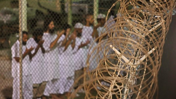Detainees pray before dawn this week near a fence of razor-wire, inside the Camp 4 detention centre at Guantanamo Bay  in  Cuba.