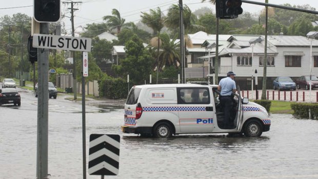 Flood alert ... police in the suburb of Wilston in Brisbane.