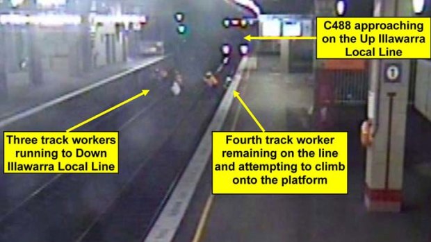 Never had a hope ... CCTV of the train about to strike Tamati Grant, left with his grandson Vinnie.