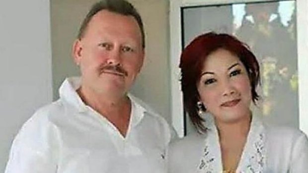 Bob Ellis with his wife Julaikah Noor Aini, who is a prime suspect in his murder. 