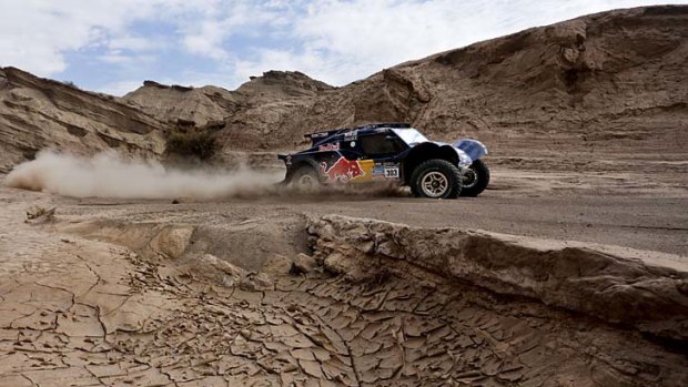 Carlos Sainz and co-driver Timo Gottschalk compete during the fourth stage of the Dakar Rally.