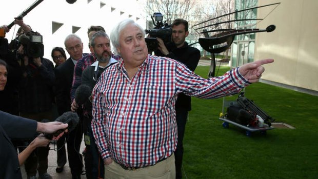 Look, over there: Clive Palmer addresses the media.