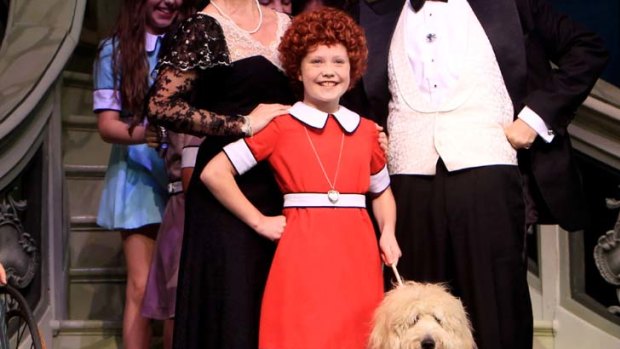 Paws in performance ... Ella Nicol as Annie and, right, Coogee the groodie.