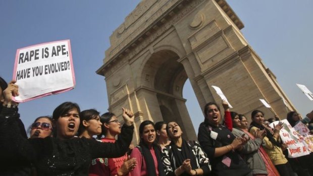 Enough is enough: Demonstrators hold placards in front of the India Gate as they protest in Delhi. 