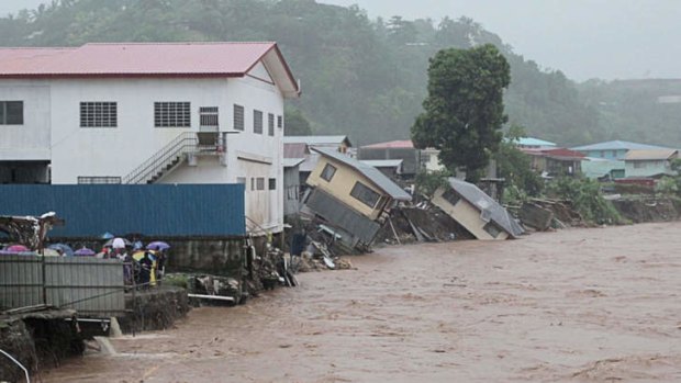 Flood waters in the streets of the Solomon Islands' capital Honiara. Flash flooding killed at least sixteen people and left 10,000 people homeless in Honiara on April 4.