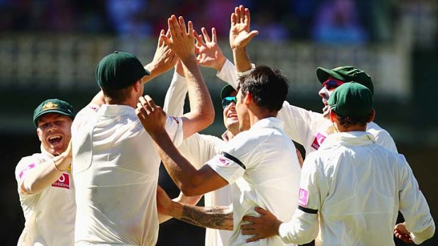 Victory in sight: The Australians celebrate after dismissing Lahiru Thirimanne at the SCG.