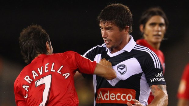 Adelaide's Zenon Caravella argues with Victory's Harry Kewell.