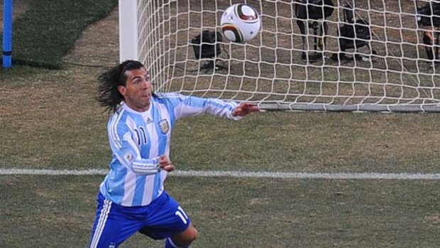 Grave error ... Carlos Tevez scores for Argentina from an offside position.