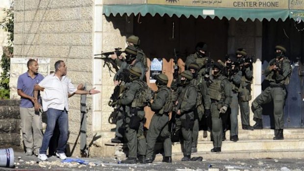 A Palestinian argues with Israeli border police in Jerusalem.