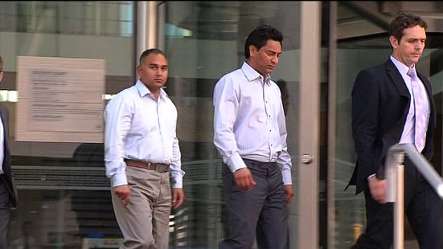 Prabhjit Gill (L) and Amrit Singh (R) with their lawyer Steven Shadgett outside District Court.