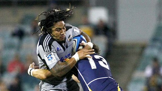 Big man on little playmaker . . .  Ma'a Nonu proves a handful for Matt Giteau in the round eight Super Rugby clash between the Hurricanes and Brumbies.