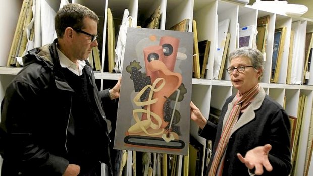 Andrew Donaldson and Dr Ann Stephen with a 1930s painting by the rediscovered avant-garde pioneer J.W. Power, titled <i>Susannah and the Elders </i>.