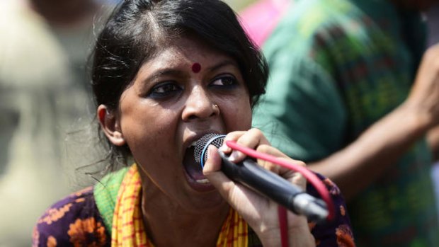 A Bangladeshi social activist shouts slogans against Ghulam Azam, whom she and other protesters wished to be sentenced to death, outside a court in Dhaka.
