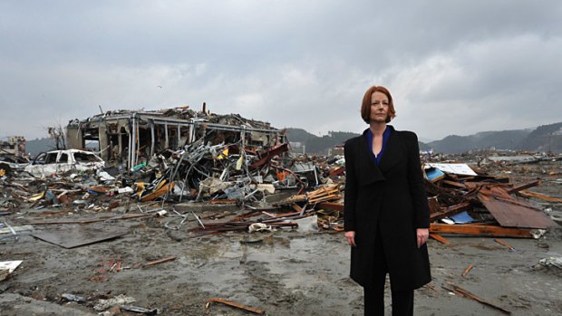 Scenes of devastation ... Julia Gillard among the wreckage at Minamisanriku.