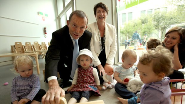 Father figure: Tony Abbott, with wife Margie, meets children at the Capital Hill Early Childhood Centre at Parliament House.