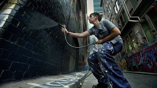 Hosier Lane is given a fresh undercoat to provide a clean slate for 100 artists who will transform it over six days as part of the <i>Melbourne Now</i> project ALLYOURWALLS.
