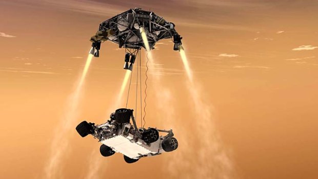 An artist's impression of the sky crane maneuver during the descent of NASA's Curiosity rover to Mars.