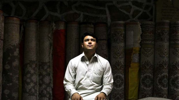 On the fringe &#8230; Mohammad Ali at work in a carpet shop in Kabul. His bid to escape Afghanistan ended on the Tampa 10 years ago.