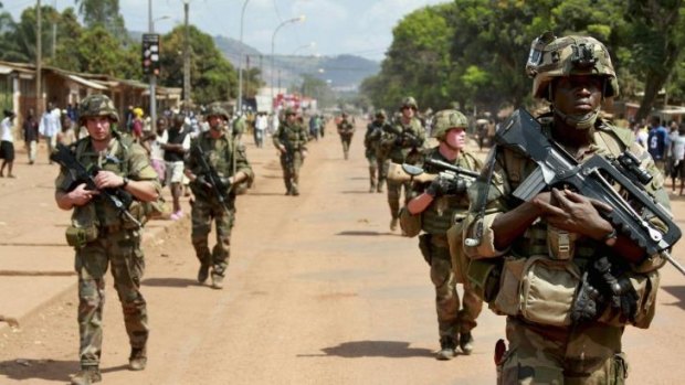 French soldiers patrol on foot in Bangui.
