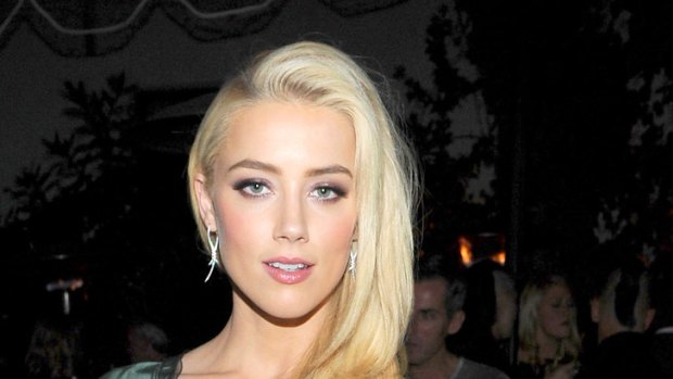 Silky simplicity ... Amber Heard's maximises her red carpet presence.