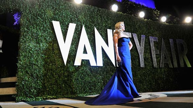 Reese Witherspoon arrives at the 2013 Vanity Fair Oscar Party.