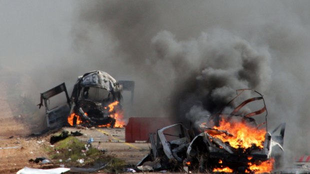 Israeli military vehicles  burning in the Shebaa farms an occupied area along the Israeli-Lebanese border near Ghajar village, on Wednesday.