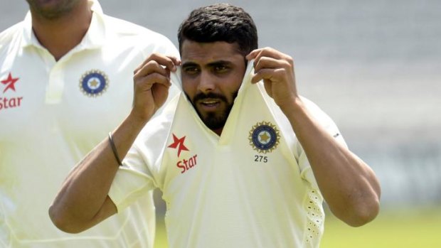 In the spotlight: India's Ravindra Jadeja pulls up his shirt collar as he walks across the field during a training session before the second cricket test match against England at Lord's.