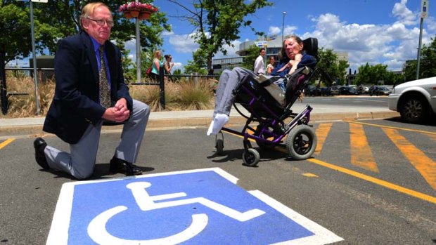 Roy and Jennifer Edgar at one of the new disabled car spaces in the City.