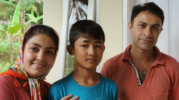 Afghan refugee Omid Jafary, 12, with foster mother Fatima Ramazani and father Majtaba Jafariyam in Cisarua, Bogor, Indonesia.