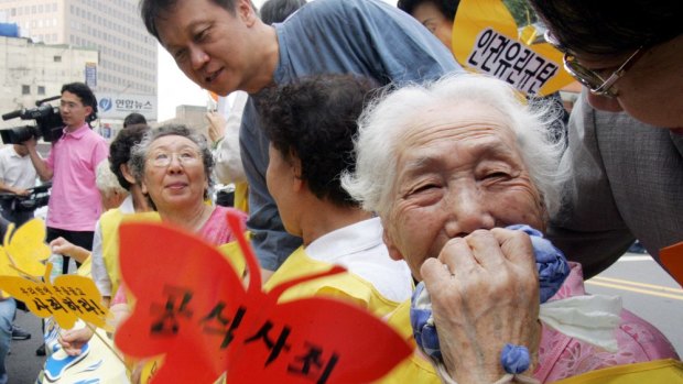A former South Korean comfort woman Lee Sun-duk, right,  and other comfort women who were forced to serve for the Japanese Army as a sexual slave during World War II.