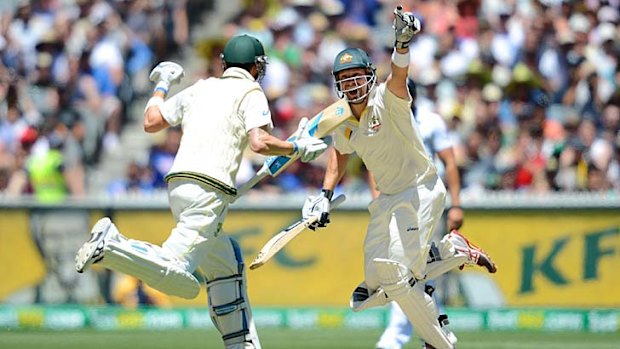 Shane Watson celebrates hitting the winning runs with Michael Clarke.