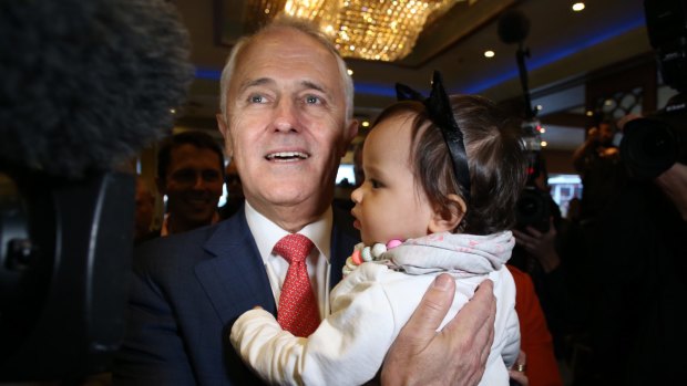 Mr Turnbull hugs his granddaughter Isla as he and Lucy Turnbull arrive at the Sunny Harbour Yum Cha restaurant in Hurstville, Sydney on Wednesday.