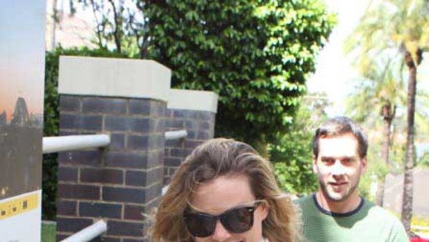 "Have a nice day" ...Kristy Fraser-Kirk outside of her Sydney home yesterday.
